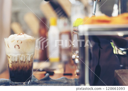 Latte art coffee cup with milk on wooden table. Espresso shot make latte art hot coffee cup. Cappuccino with milk in italian coffee shop cafe. Brown hot caffeine beverage in cafeteria with copy space Latte art coffee cup with milk on wooden table. Espresso shot make latte art hot coffee cup. Cappuccino with milk in italian coffee shop cafe. Brown hot caffeine beverage in cafeteria with copy space 128661093