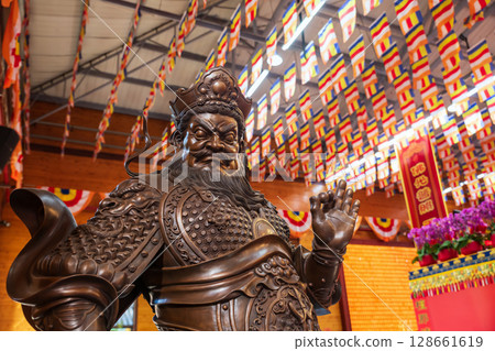 Guan Yu sculpture statue against flags in Longhua temple, Shanghai 128661619