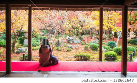 Young lady on Enkoji temple terrace view colorful autumn leaf, Kyoto Young lady on Enkoji temple terrace view colorful autumn leaf, Kyoto 128661647