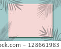 On a green background, a pink frame for text covered with a shadow from tropical leaves. 128661983