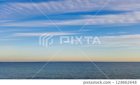 beautiful seascape with dramatic clouds in the sky 128662648
