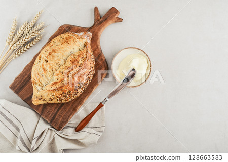 Tasty multigrain french bread with butter 128663583