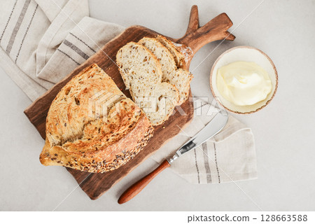 Tasty multigrain french bread with butter 128663588