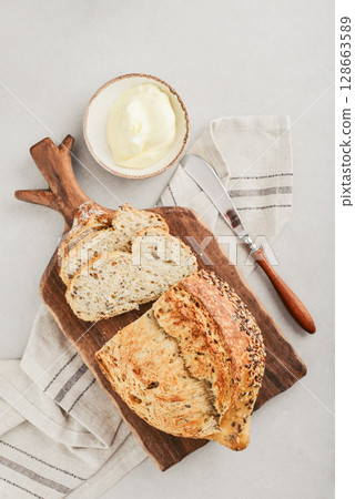 Tasty multigrain french bread with butter Tasty multigrain french bread with butter 128663589