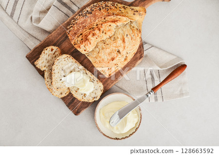 Tasty multigrain french bread with butter Tasty multigrain french bread with butter 128663592