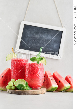 Fresh watermelon juice with framed chalk board. 128663615