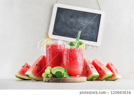 Fresh watermelon juice with framed chalk board. Fresh watermelon juice with framed chalk board. 128663616
