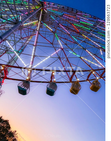 Ferris wheel dyed at sunset 128663723