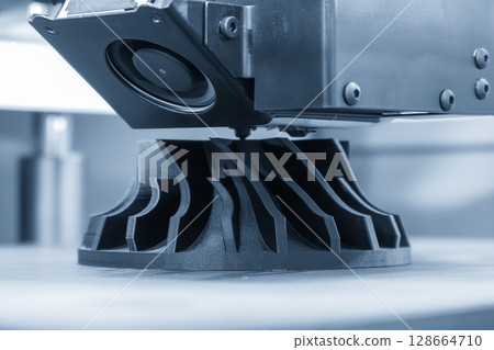 Close up scene the 3D model operation by additive manufacturing by 3D printer machine in the blue tone. 128664710