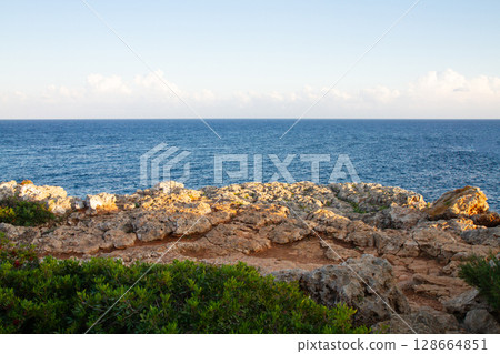 horizon on a beautiful seascape from a rocky shore horizon on a beautiful seascape from a rocky shore 128664851