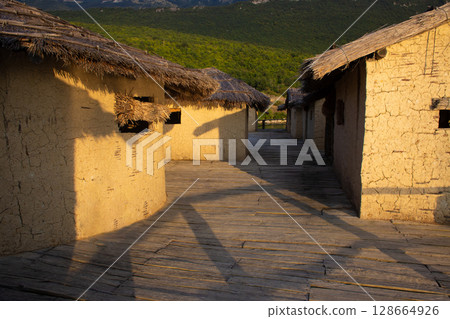 mud houses bungalow on the shore of the lake 128664926