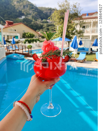 close up of a beautiful fruity alcoholic cocktail 128664927