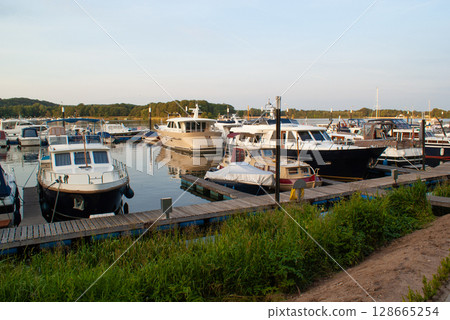 beautiful ships and boats are moored near the shore beautiful ships and boats are moored near the shore 128665254