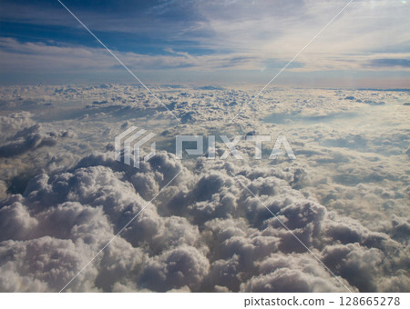 beautiful thick clouds in the sky from the height of the plane 128665278