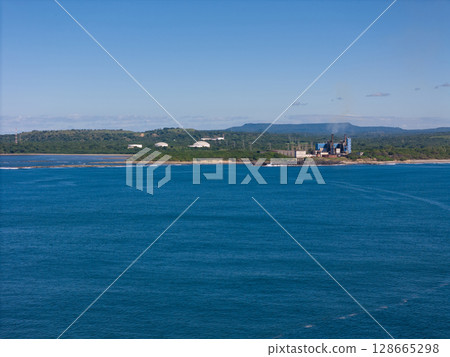 Factory plant on sea coast Factory plant on sea coast 128665298