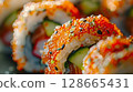Close-Up: Spicy Sashimi Rolls with Tuna or Salmon, Avocado, Cucumber, Spicy Mayo, and Tobiko 128665431