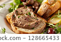 Classic Pate de Foie Gras: Smooth foie gras with cognac or Armagnac, served on toasted brioche or baguette with sweet fruit compote. 128665433
