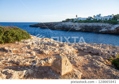 horizon on a beautiful seascape from a rocky shore 128665841