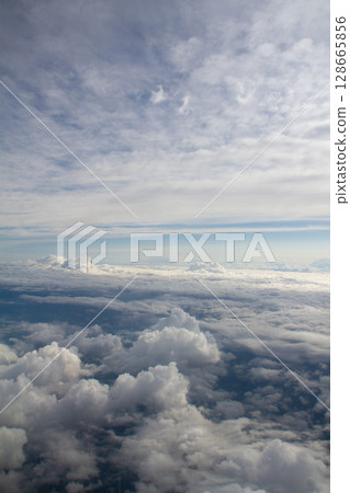 beautiful thick clouds in the sky from the height of the plane 128665856
