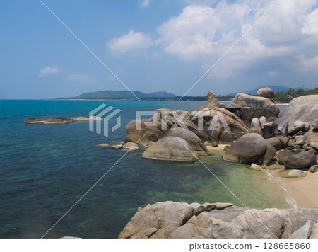 a beautiful landscape of a sea beach and mountainous mountains 128665860