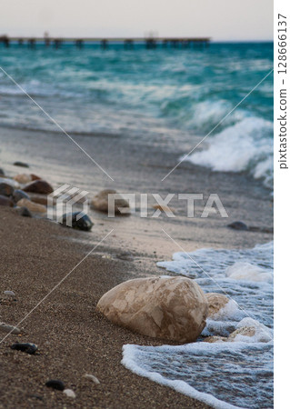 beautiful landscape of a sandy beach on the sea beautiful landscape of a sandy beach on the sea 128666137