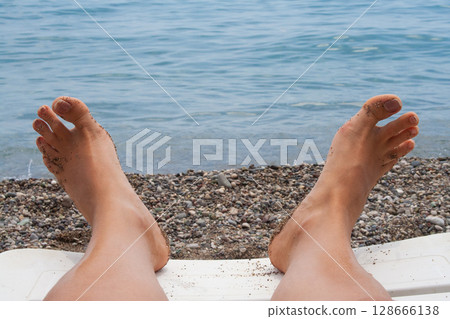 close up of bare feet on the beach close up of bare feet on the beach 128666138