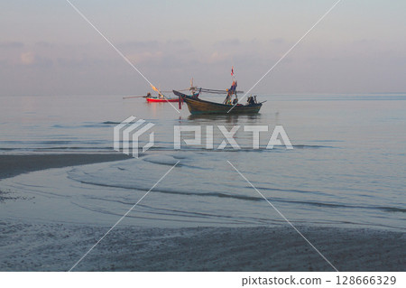 fishing motor boats moored on the sea coast fishing motor boats moored on the sea coast 128666329