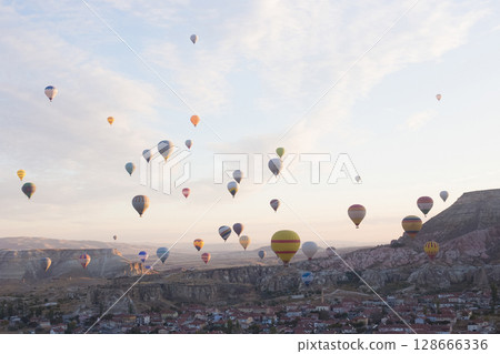 beautiful scenery flight of balloons in the mountains of Cappadocia in love valley beautiful scenery flight of balloons in the mountains of Cappadocia in love valley 128666336