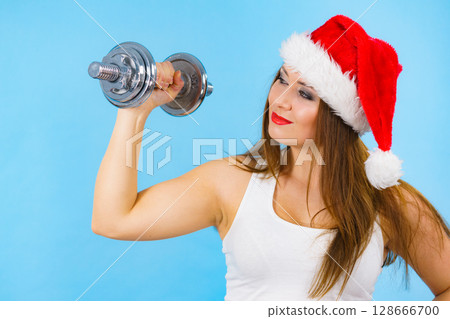 Santa claus woman lifting dumbbells 128666700