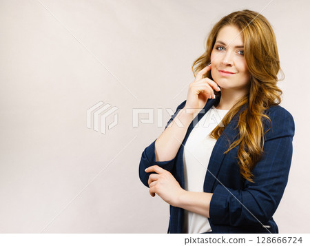 Business woman in suit looking at camera 128666724