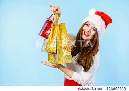 Happy Christmas woman with paper gift bags Happy Christmas woman with paper gift bags 128666813