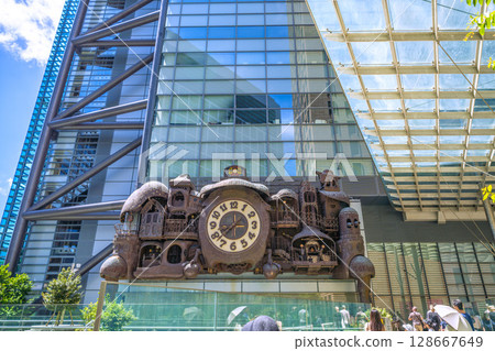Tokyo cityscape in Japan: A view of the symbol of Shiodome, bustling with foreign tourists, including the mechanical clock "NTV Big Clock" 128667649