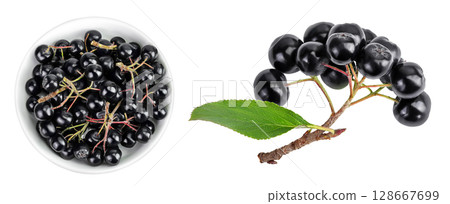 Chokeberry in ceramic bowl with leaf isolated on white background. Black aronia. Top view. Flat lay Chokeberry in ceramic bowl with leaf isolated on white background. Black aronia. Top view. Flat lay 128667699