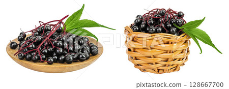 Ripe black elderberry or elder with green leaves in wooden bowl isolated on a white background. Sambucus Ripe black elderberry or elder with green leaves in wooden bowl isolated on a white background. Sambucus 128667700