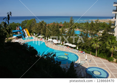 a beautiful large swimming pool near the house 128668470