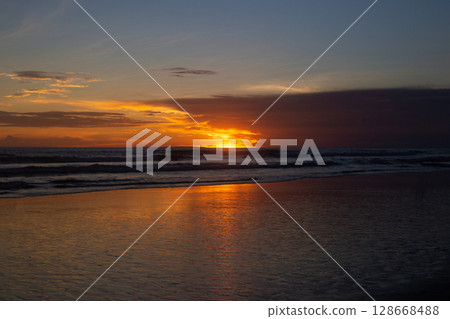 beautiful dramatic landscape of sunset on the sea beach 128668488