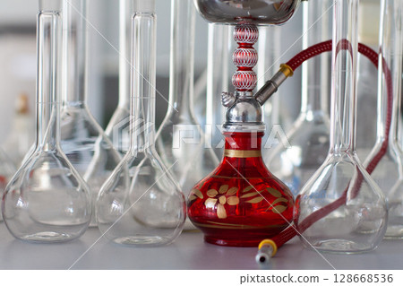 composition of red hookah and chemical glass flasks composition of red hookah and chemical glass flasks 128668536
