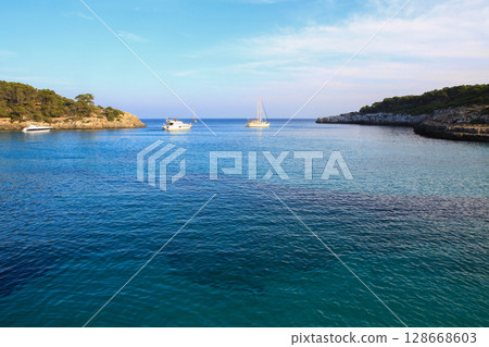 beautiful ships and boats are moored near the shore 128668603