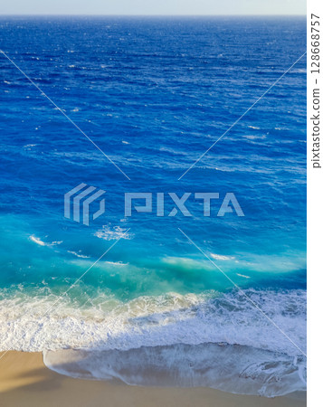 beautiful landscape of a sandy beach on the sea 128668757