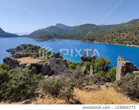 a beautiful ship is sailing in the blue sea 128668772