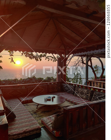 beautiful interior of a restaurant on the seashore 128668855