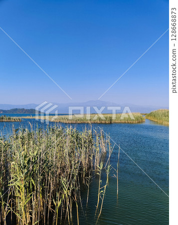 beautiful landscape of the lake against the background of mountains beautiful landscape of the lake against the background of mountains 128668873