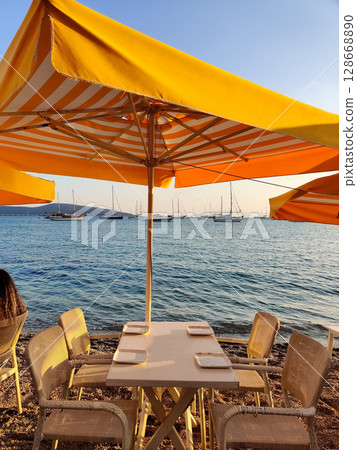 beautiful ships and boats are moored near the shore beautiful ships and boats are moored near the shore 128668890