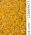 Golden ginkgo leaves create a vibrant, textured carpet on the ground during autumn in Kyoto 128669473