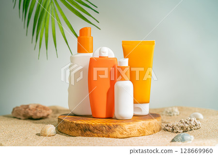Sun care bottles on wood stand 128669960