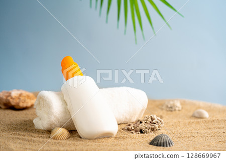 Sun care bottles on wood stand 128669967