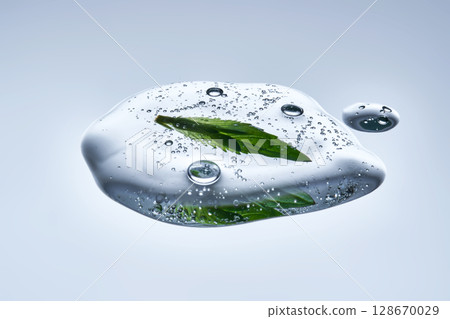 A drop of natural cosmetics with a mint leaf. A drop of natural cosmetics with a mint leaf. 128670029