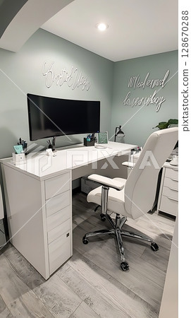 A white desk with a black computer monitor and a white chair 128670288
