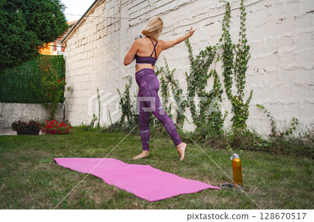 Mother engages in exercise routine to regain confidence after childbirth 128670517