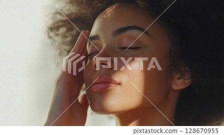 woman with natural makeup and afro hair 128670955